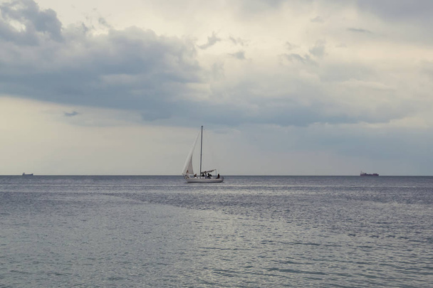 Boat in the sea, single yacht in blue sea - Photo, Image