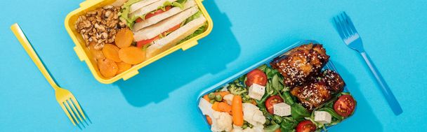 panoramic shot of lunch box with food near plastic utensils - Photo, Image