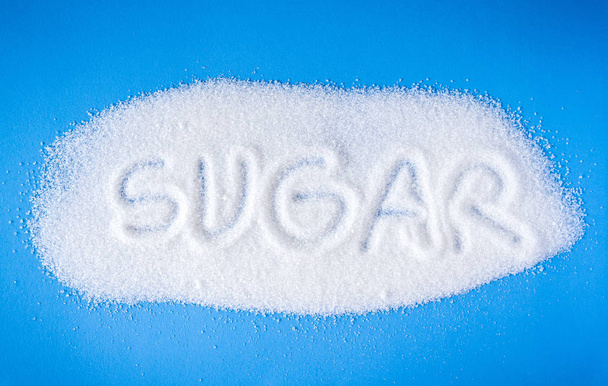 white sugar sand on blue background  - Фото, изображение