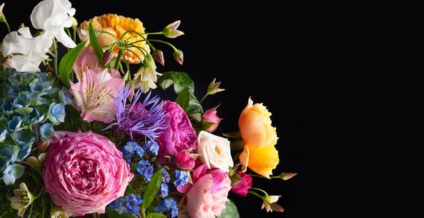 Beautiful bunch of colorful flowers on black background - Foto, afbeelding