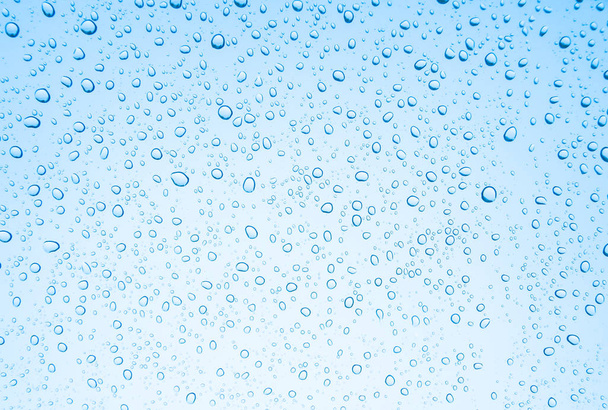 Капли голубой воды на стекло, капли дождя
 - Фото, изображение