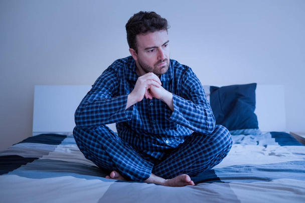 Worried man can't sleep thinking about problems - Photo, Image
