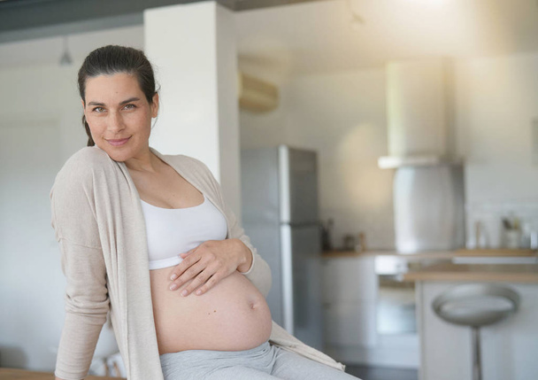 6-month-pregnant woman relaxing at home - Фото, зображення