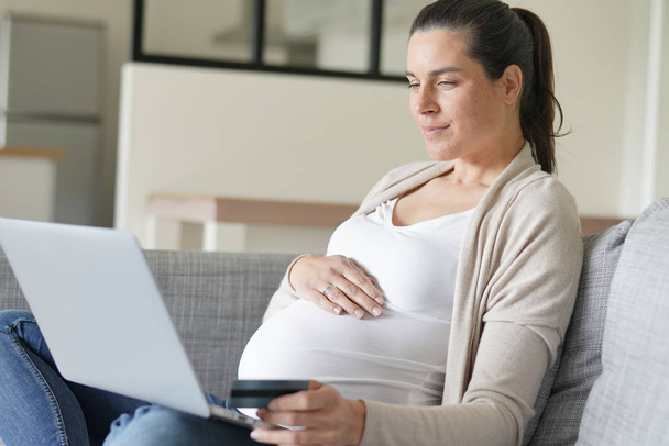 Pregnant woman doing online shopping  - Fotoğraf, Görsel