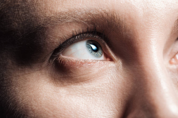 close up view of young woman grey eye looking away - Fotó, kép