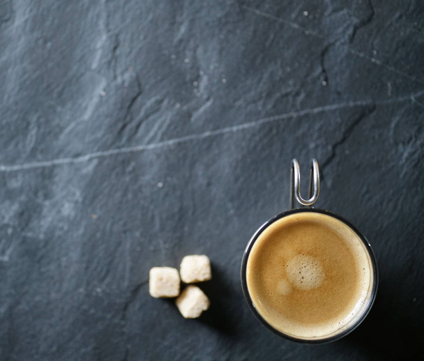 Top view of freshly brewed coffee on slate with text space - Foto, immagini