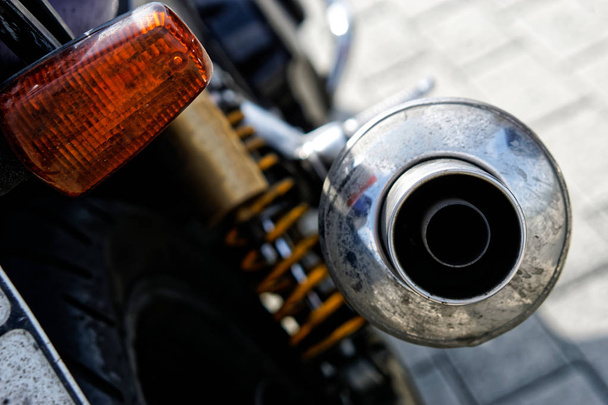 Chrome exhaust pipe with a muffler biker motorcycle. Problems of - Photo, Image