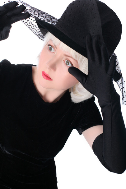 Lovely woman in hat hiding at veil - Valokuva, kuva