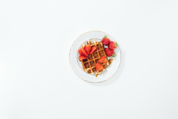 top view of plate with strawberries on waffle on plate on white - Φωτογραφία, εικόνα