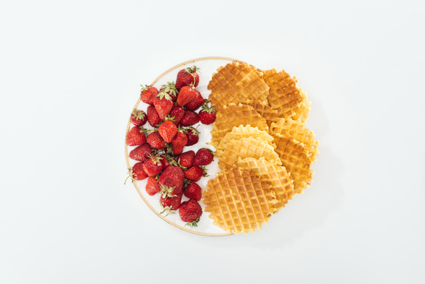 top view of big plate with strawberries and waffles on white  - Photo, Image
