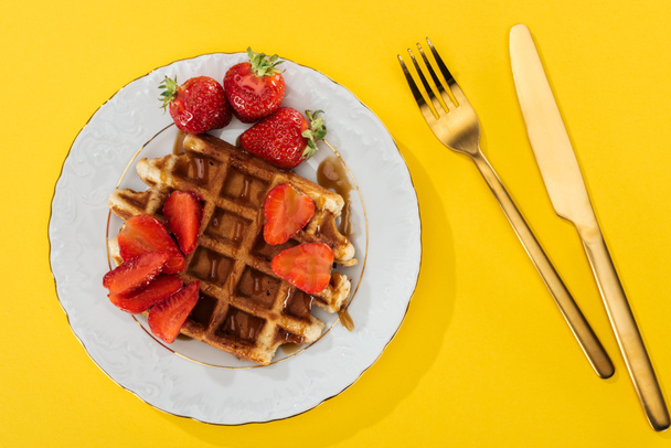 top view of plate with tasty waffle for breakfast on yellow - Photo, Image