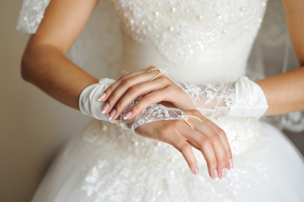 Bride hands on wedding dress - Photo, image