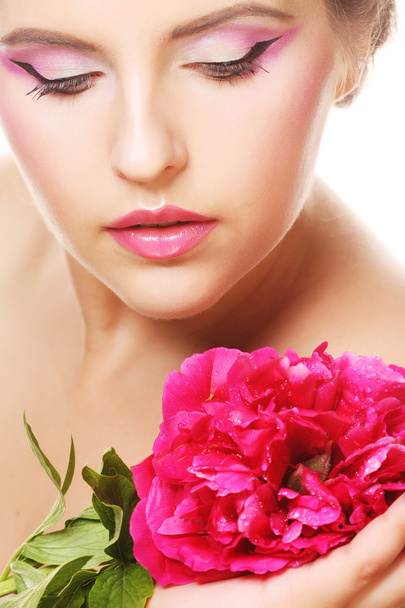 Woman with pink flower - Φωτογραφία, εικόνα