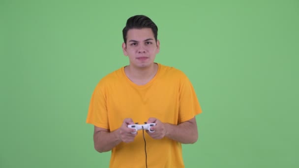 Stressed young multi ethnic man playing games and losing - Video