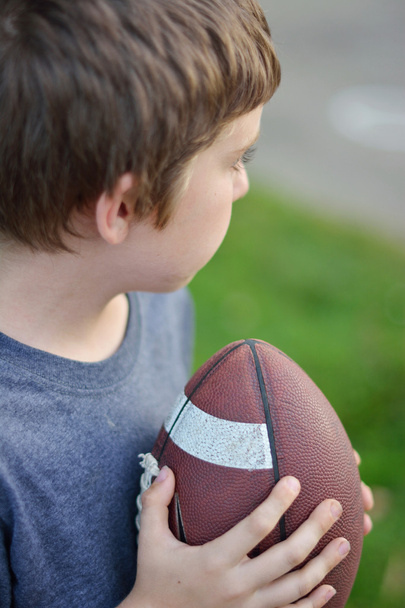Boy Holding Football - Фото, изображение