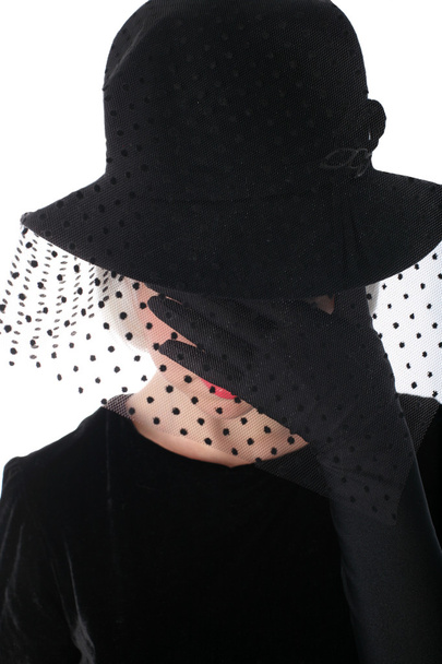 Sad woman in hat hiding at veil - Fotó, kép
