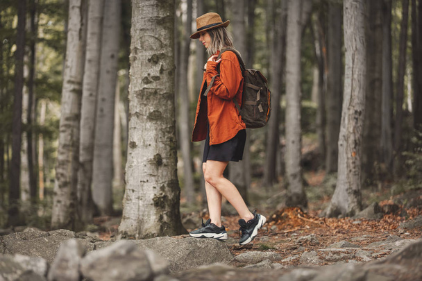 Style girl in hat with backpack in a summer time - Foto, imagen