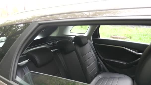 beautiful leather car interior design. luxury leather seats in the car. artificial leather rear seats in the car. Black leather seat covers in the car. - Footage, Video