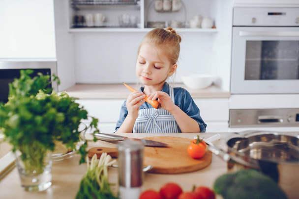 little girl in a kitchen - Photo, image