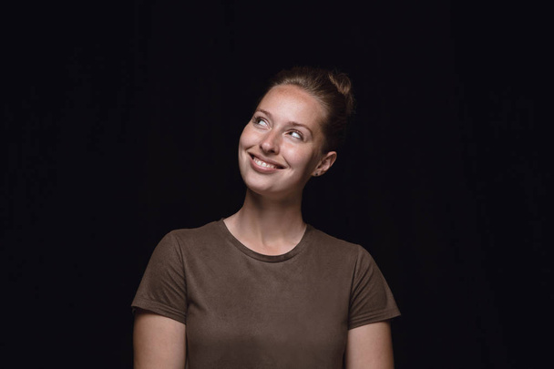 Close up portrait of young woman isolated on black studio background - Valokuva, kuva
