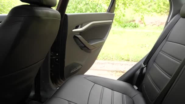 beautiful leather car interior design. luxury leather seats in the car. Black leather seat covers in the car. artificial leather rear seats in the car. - Footage, Video