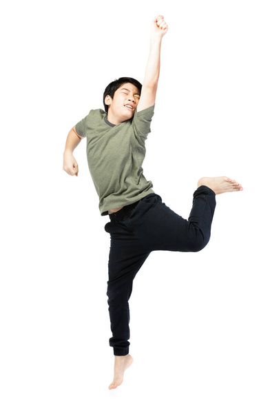 Portrait of happy little Asian child jumping isolated on white  - 写真・画像