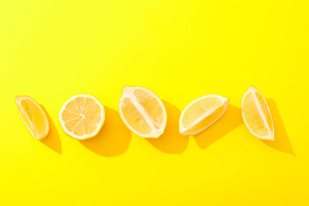 Flat lay composition with lemons on color background, space for  - Photo, Image