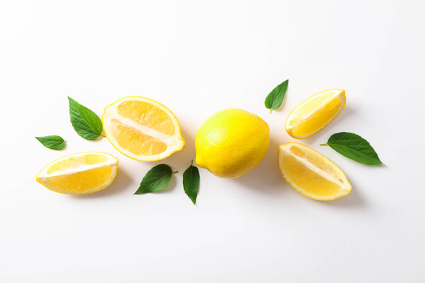 Flat lay composition with lemons on white background, space for  - Foto, Imagen