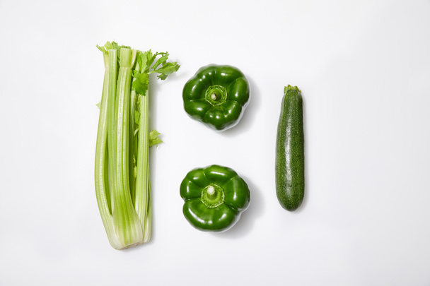 top view of green vegetables on white background - Foto, Imagem
