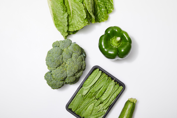 top view of green organic vegetables on white background - Φωτογραφία, εικόνα