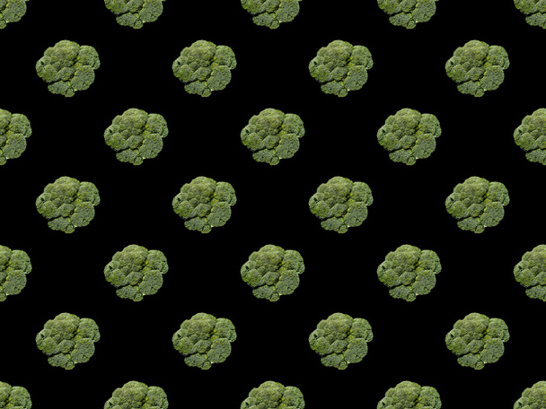 green organic whole cauliflower isolated on black, seamless background pattern - Photo, Image