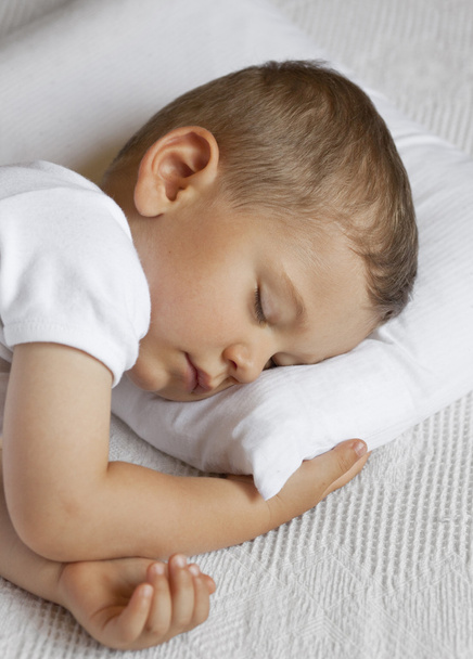 Cute child is sleeping in bed - Photo, Image