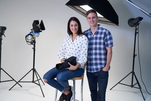Portrait Of Female And Male Photographers In Studio For Photo Sh - Foto, Imagem