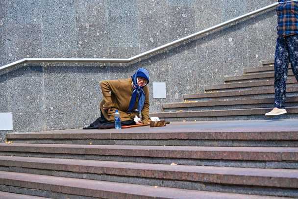   Russia Moscow June 23 2019   Beggar woman begging on the streets of Moscow. - Fotó, kép