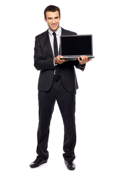 Businessman pointing at laptop - Valokuva, kuva