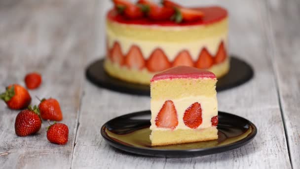 A piece of strawberry cake. Strawberry cake Fraisier with vanilla cream - Footage, Video