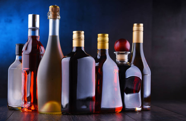 Bottles of assorted alcoholic beverages. - Photo, Image