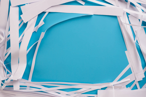 pieces of paper on blue background - Foto, imagen