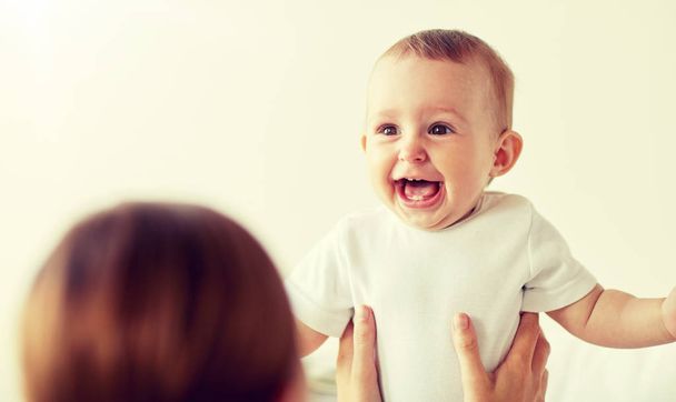 happy little baby with mother at home - Φωτογραφία, εικόνα