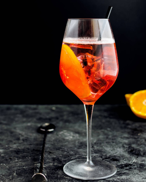 Wine glass with aperol spritz, italian alcoholic cocktail - Фото, изображение
