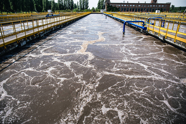 Tanks or reservoirs for aeration and purification or cleansing sewage liquid with sludge in modern wastewater treatment plant - Φωτογραφία, εικόνα
