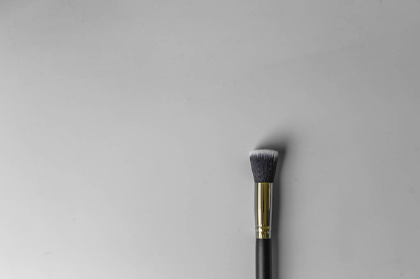 Makeup brush on a grey background - Photo, Image