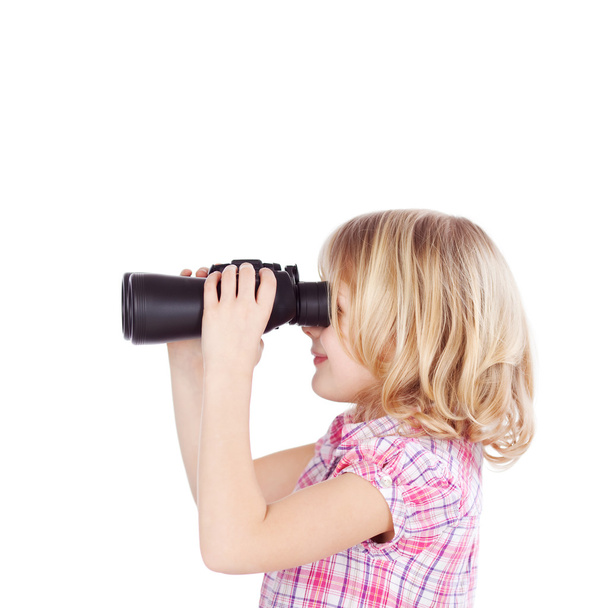 Little girl using a pair of binoculars - 写真・画像