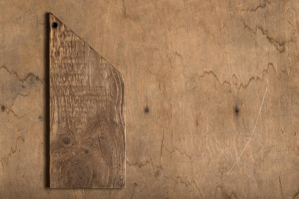 Handmade burned cutting board on a wooden rustic texture for bac - Fotografie, Obrázek
