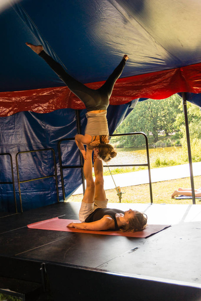 Kiel, Germany - June 23rd 2019: Presentation - Acroyoga combines the elements of yoga and acrobatics - Photo, Image