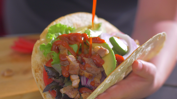 Add ketchup to the Mexican burrito food. Tortillas - Footage, Video