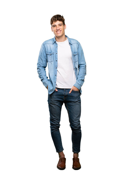 A full-length shot of a Handsome young man laughing over isolated white background - Valokuva, kuva