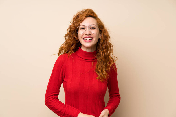 Redhead woman with turtleneck sweater with glasses - Valokuva, kuva