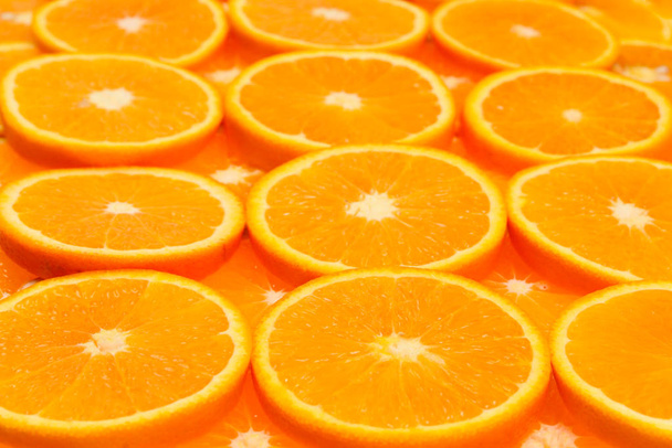 Orangenscheiben als Hintergrund, Draufsicht.  - Foto, Bild