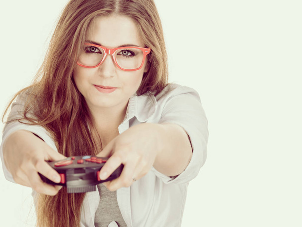 Gamer woman holding gaming pad - Photo, image